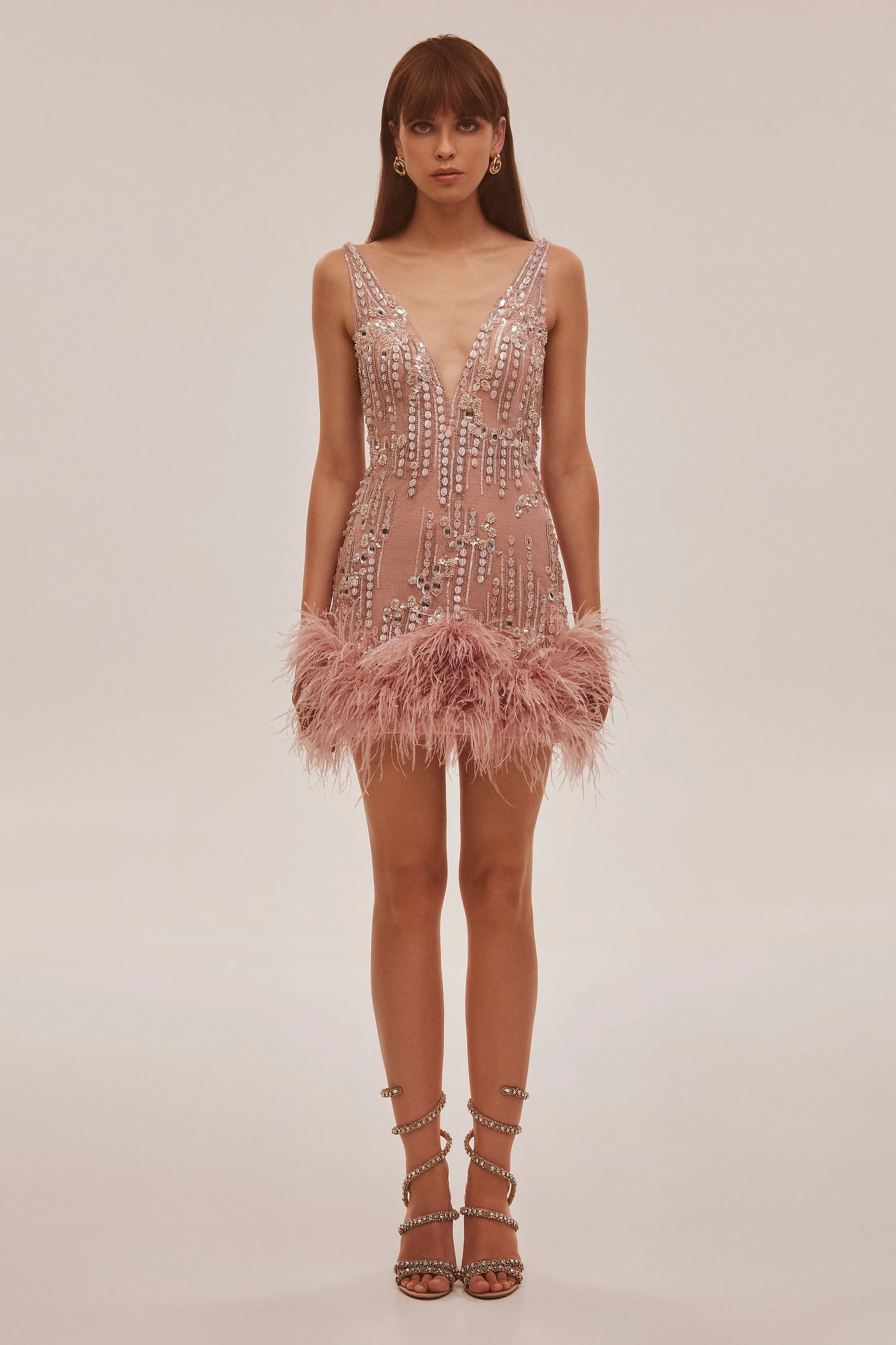 Fabulous mini dress on straps adorned with crystals and feathers